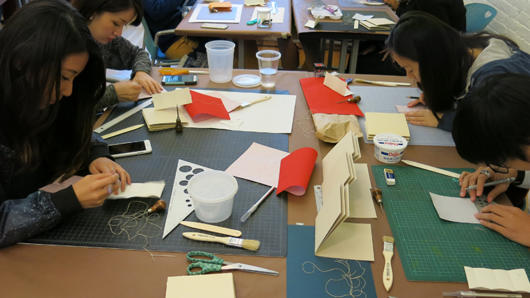 students working with materials and tools in the course class