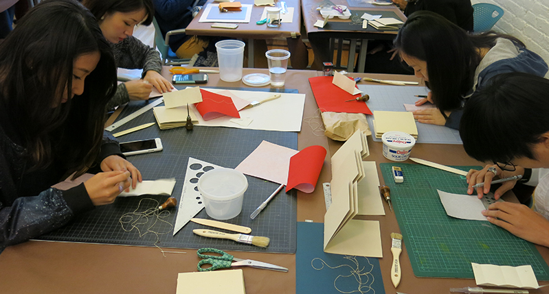 students working with materials and tools in the course class