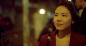 Livia Ito in red jacket