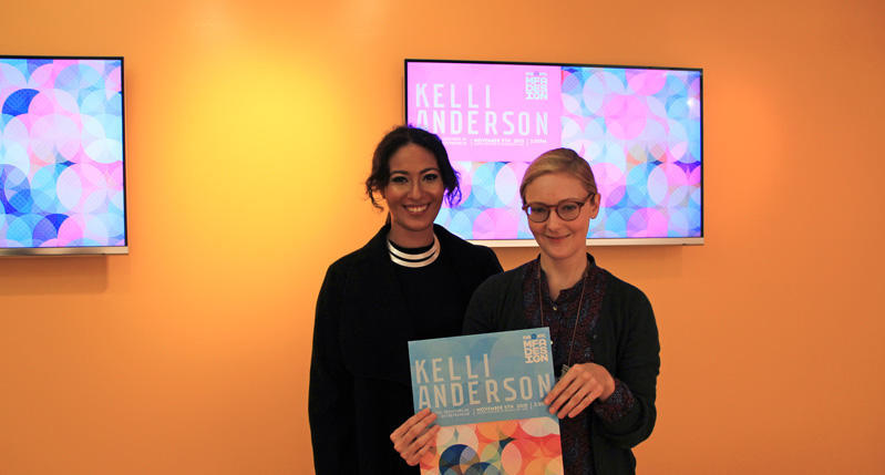 portrait of two women holding a Kelli Anderson book
