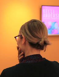 photo of a woman looking away from her back