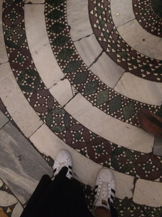 stepping on a floor mosaic