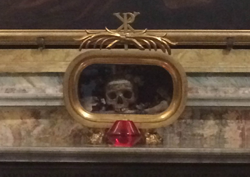 gold framed skull