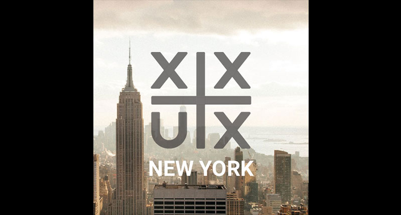 A photo of the city scape of New York and on it some X and U letters put in a square formation and separated by horizontal and vertical lines.