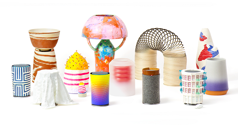 A photo of colorful gradient plastic cups, 3d can designs, napkins, a slinky and other type of colorful pottery.