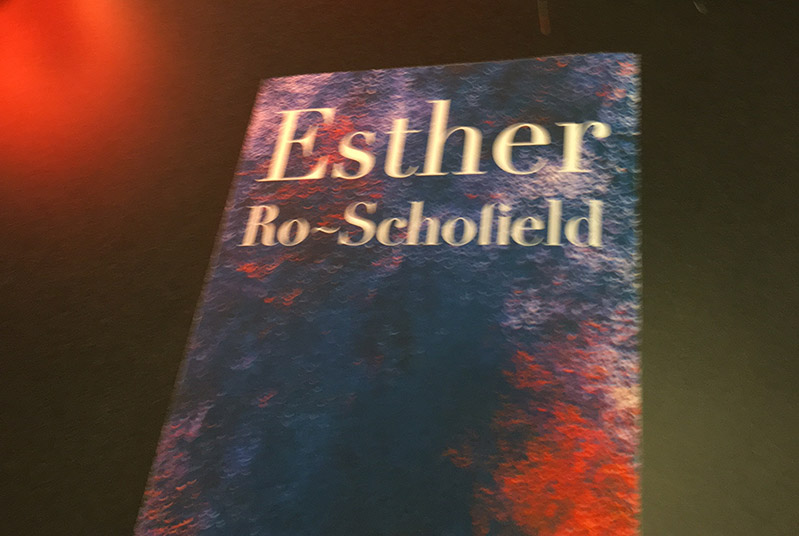 Esther Ro-Scholied poster with deep blue and bright red