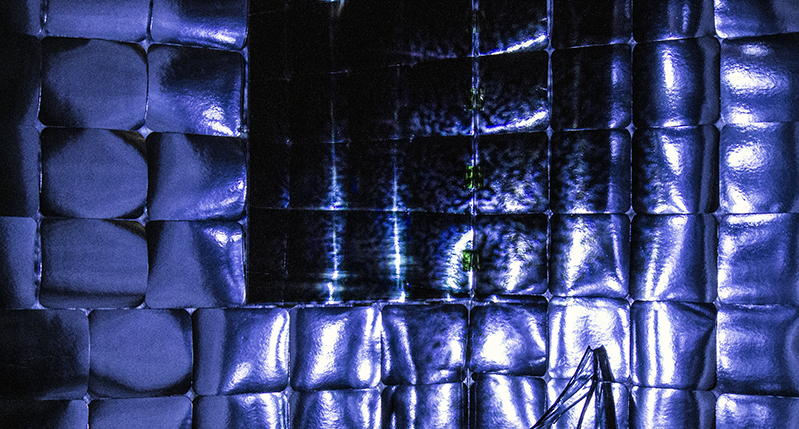 A photo of some blue item made from inflated bubble wrapper.