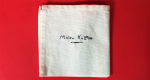 maria kalman embroidered on a piece of cloth