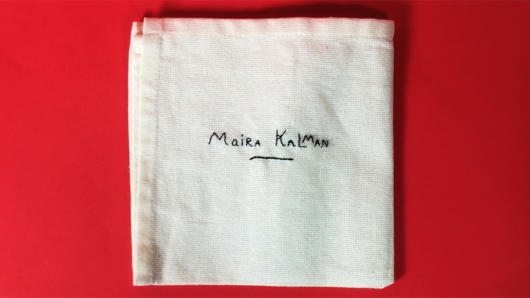maria kalman embroidered on a piece of cloth