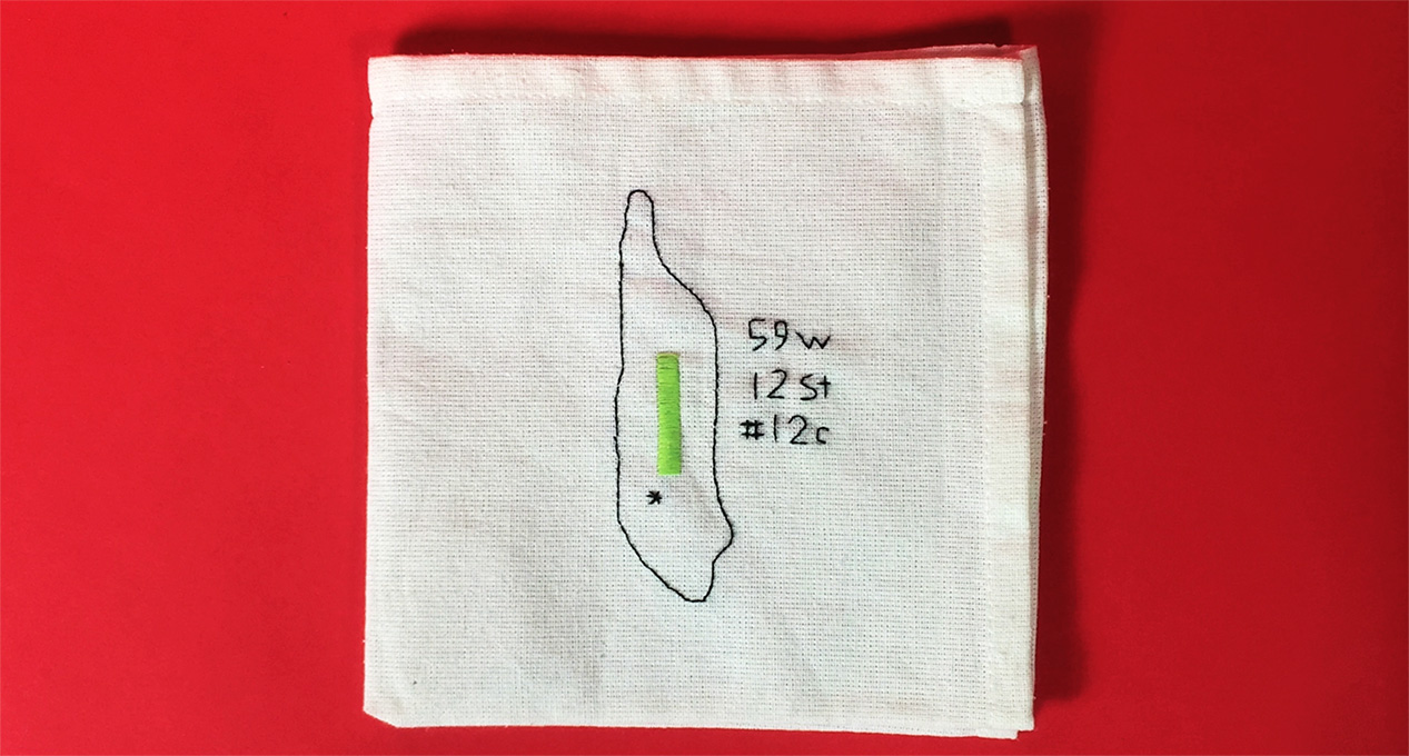 event location address embroidered on a piece of cloth