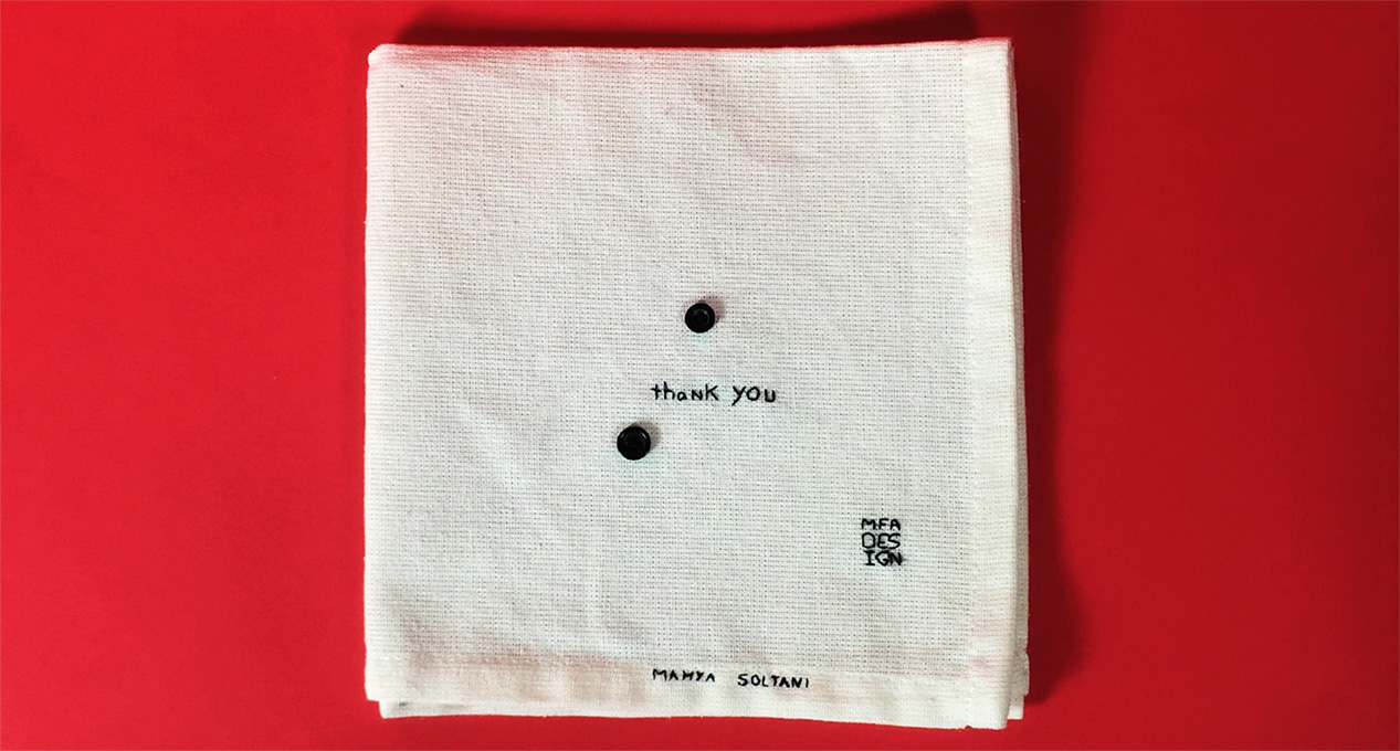 thank you embroidered on a piece of cloth