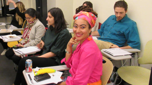 portrait of a woman dressed in pink in the class