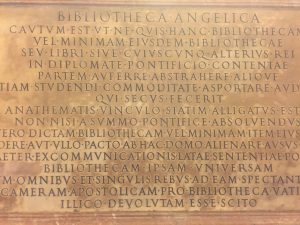 A stone engravement text related to a church library.