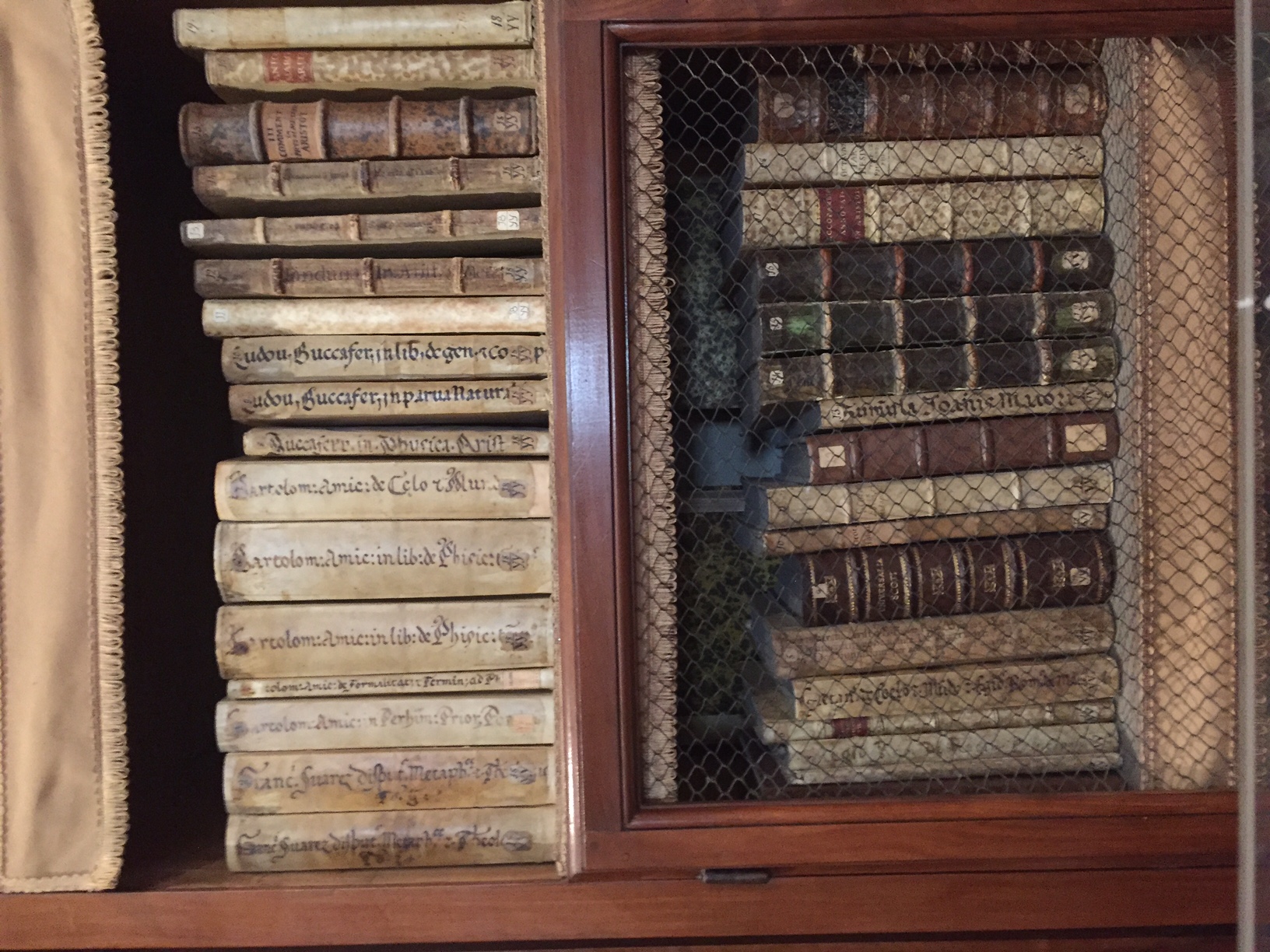 Stash of old books and manuscripts inside a cabinet.