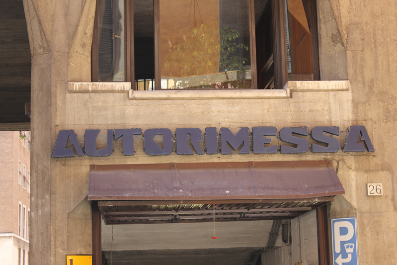 autorimessa shop name made with blue letters above the entrance