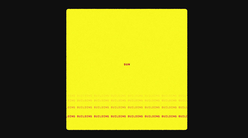 A yellow cube on a black background. The yellow cube has some red text on multiple lines that are fading.
