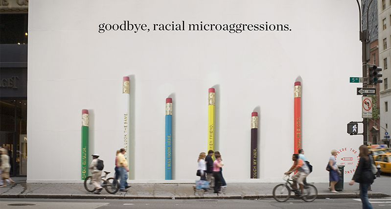 A white street wallpaper with some colored crayons, each having erasers on top of them. The title on it says: goodbye, racial microaggressions.