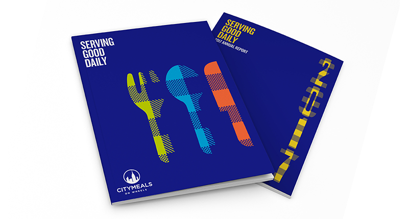 A 3d generated design of two blue notebook covers. On one of them there is a drawing of a green fork, a blue spoon and a red knife. The text on it says Serving Good Daily. On the other notebook there is a yellow number and the same text.