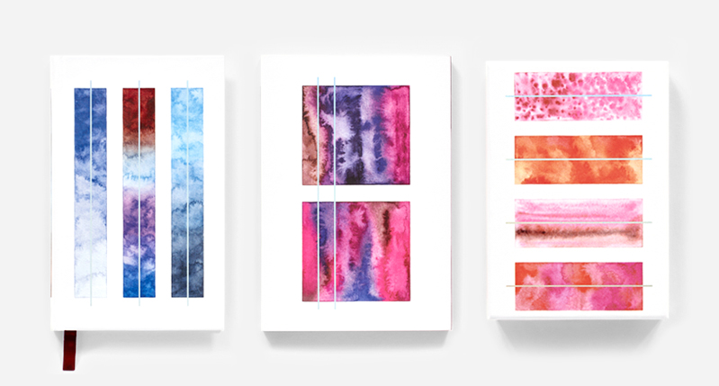 A set of three papers with multicolored sample strips that look like cloud formations.