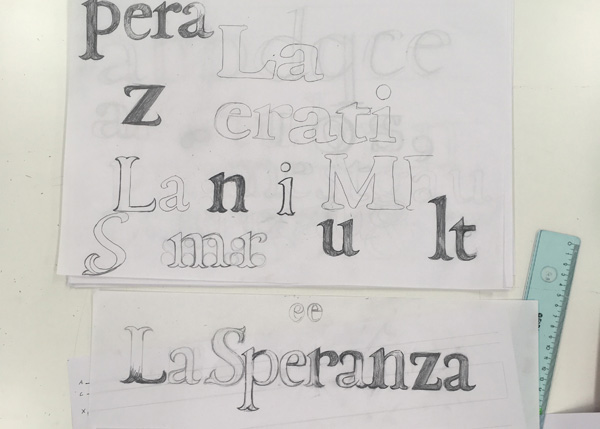 A photo of pieces of paper with some typographic text drawing.