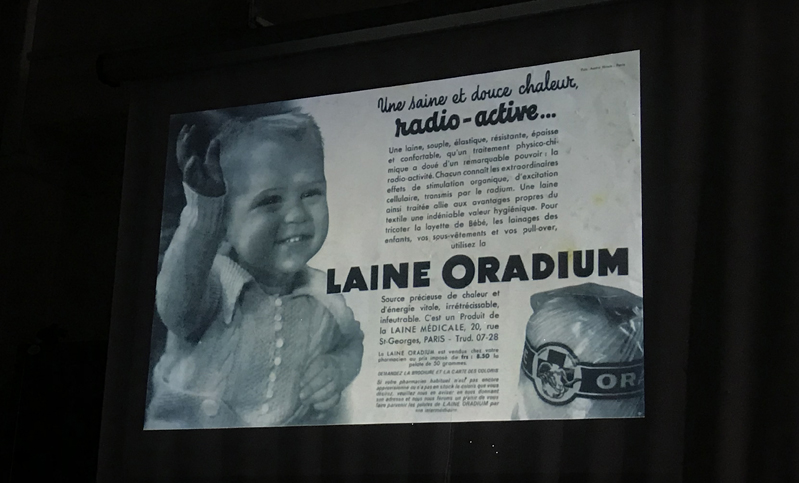 A photo of a newspaper article with pictures of children. On it there is the text: radio active Laine Oradium.