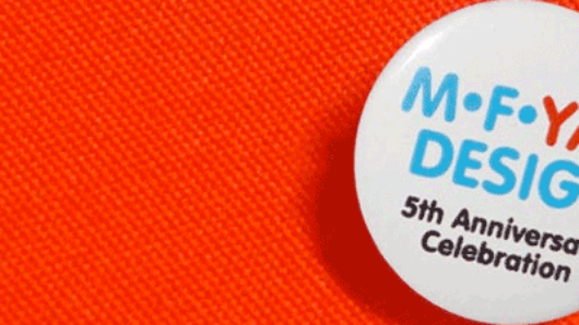 a pin of MFAD 5th anniversary celebration