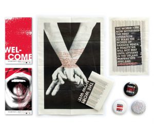 A photo of some flyers that show welcome, a shouting mouth, hands tied by strings of words, newspaper columns. Also, in a corner, there are some clip-on custom campaign buttons.