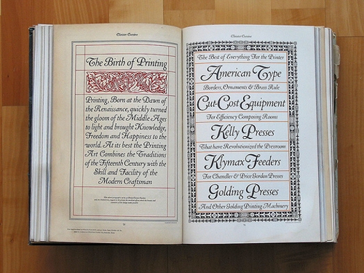 An opened book with caligraphy fonts print.