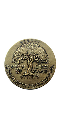 A picture of a medal with an embossed tree on it. The text on the medal: Beauty Special Medal Of Awards. American Institute of Graphic Arts.