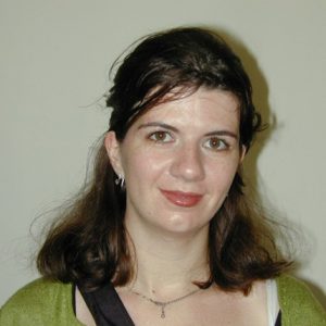 A photo of a woman smiling.