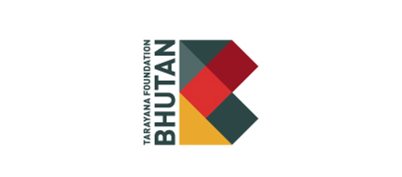 A gray, red and yellow logo made from polygons along with the text Tarayana Foundation Bhutan.