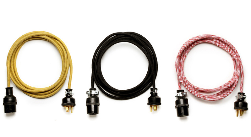 A picture showing a yellow, black and pink extension cords.