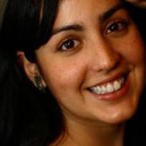 A photo of a smiling woman.
