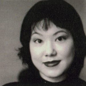 A photo of a woman smiling.