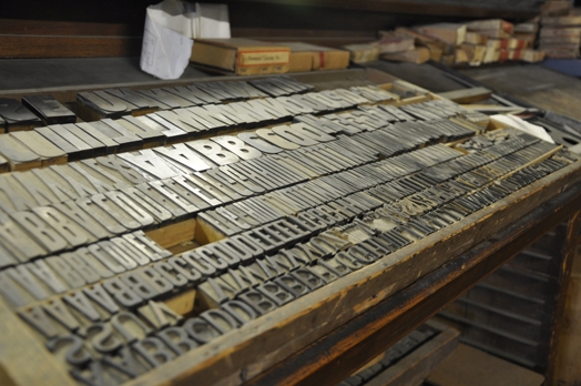 A photo of some metallic letters used for a printing press.