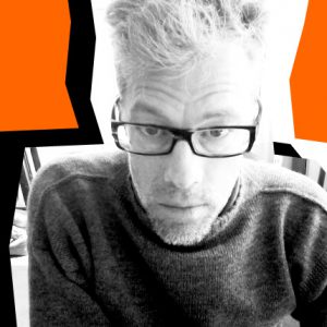 A black and white photo of a man wearing glasses stitched on an orange background.
