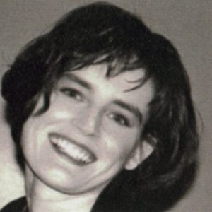 A photo of a woman smiling.