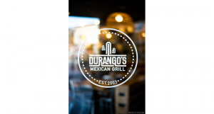 A white logo on a store glass which shows a cactus and the text: Durango's Mexican Grill.