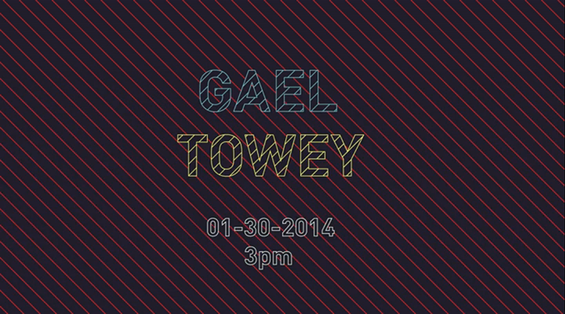 A black poster with red striped lines and the text written in yellow and blue striped lines. The text says: Gael Towey.