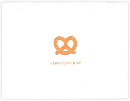 A drawing of an orange pretzel with text: Happy Birthday.