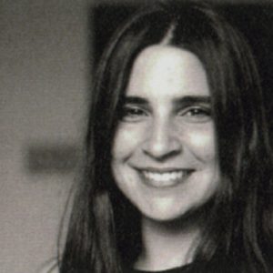 A photo of a woman smiling.