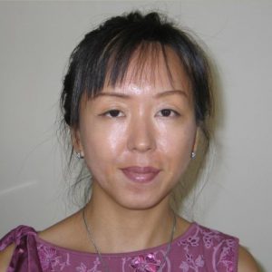 A photo of a woman wearing a purple dress.