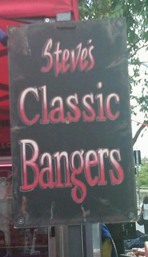 A black street sign with the words Steve's Classic Bangers written in white and red gradient.