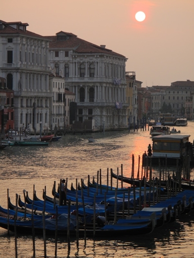A photo of gondolas at sunset in Venice.
