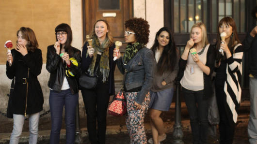 A photo of a group of women enjoying some ice-cream cones.