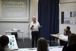 A photo of a teacher giving a lecture on Calligraphy and Epigraphy.