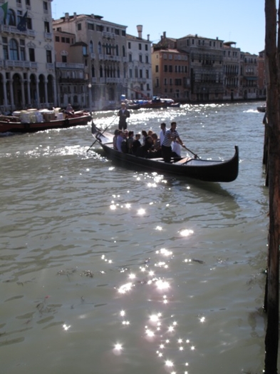 A gondola in Venice filled with people.