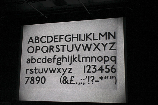 A screen projection of alphanumeric characters and other symbols.