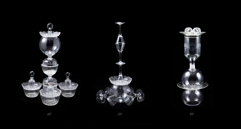 A photo of three objects made from glass.