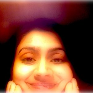 A photo of a woman smiling.